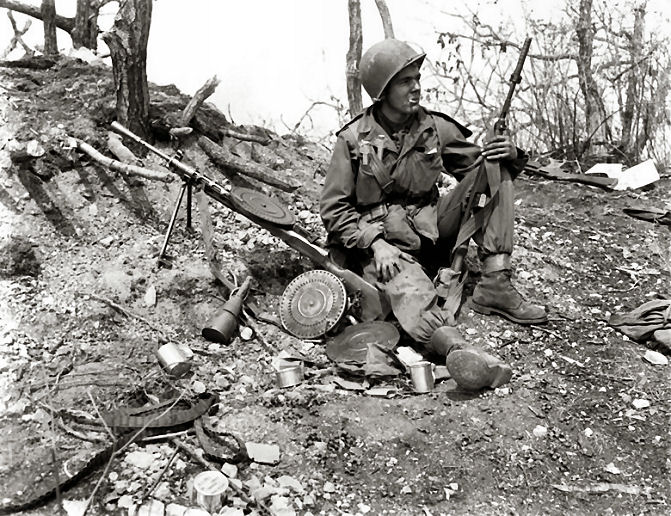 7th Infantry soldier on captured Chinese position
